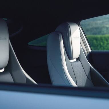 2027 Honda Prelude front seats headrest with embossed Prelude logo detail (exhilarating hybrid coupe).